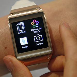samsung watch on wrist showing four icons