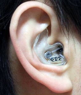 Picking up signals: A custom earpiece with three electrodes records from within the hearing canal.